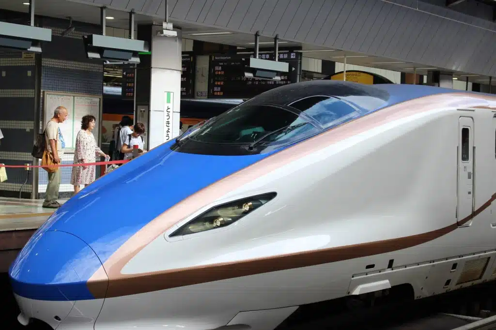 The sleek, aerodynamic front of a bullet train at a station platform, symbolizing the maximum efficiency and streamlined planning achieved through yearly initiatives in speech therapy.