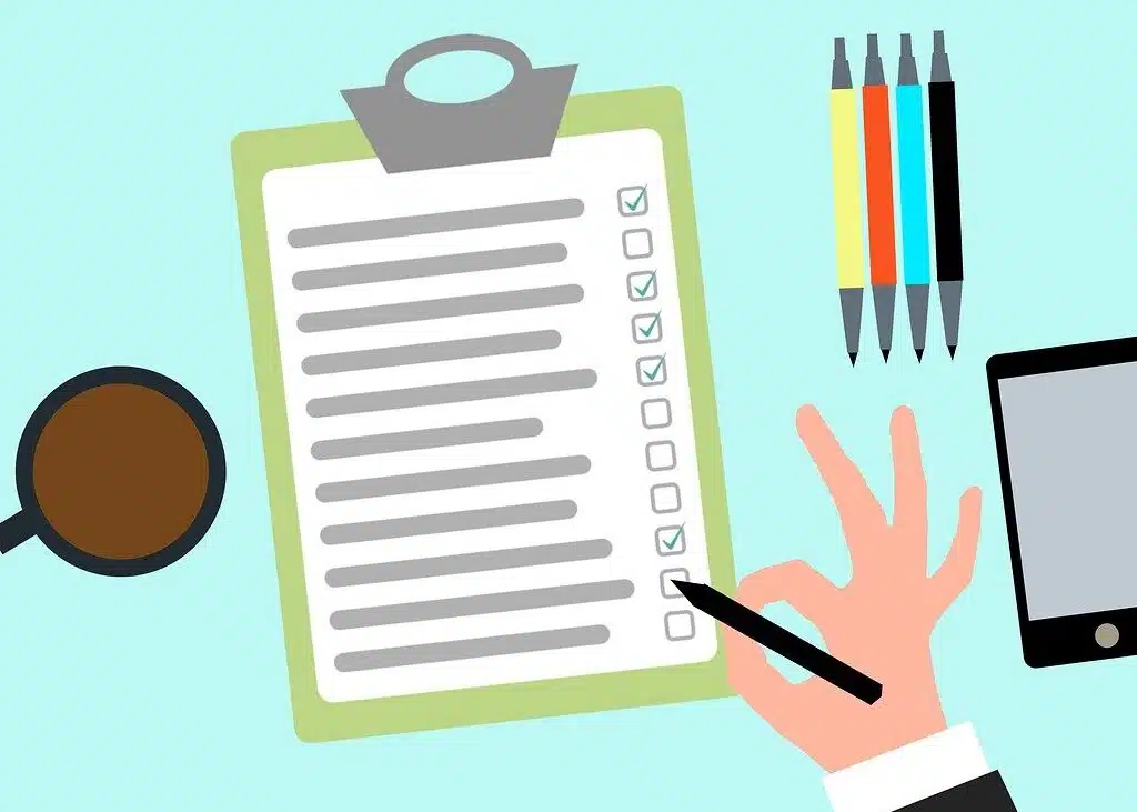 Cartoonish illustration of a hand holding a pen and checking off items on a list displayed on a clipboard, symbolizing task completion and checklist management.