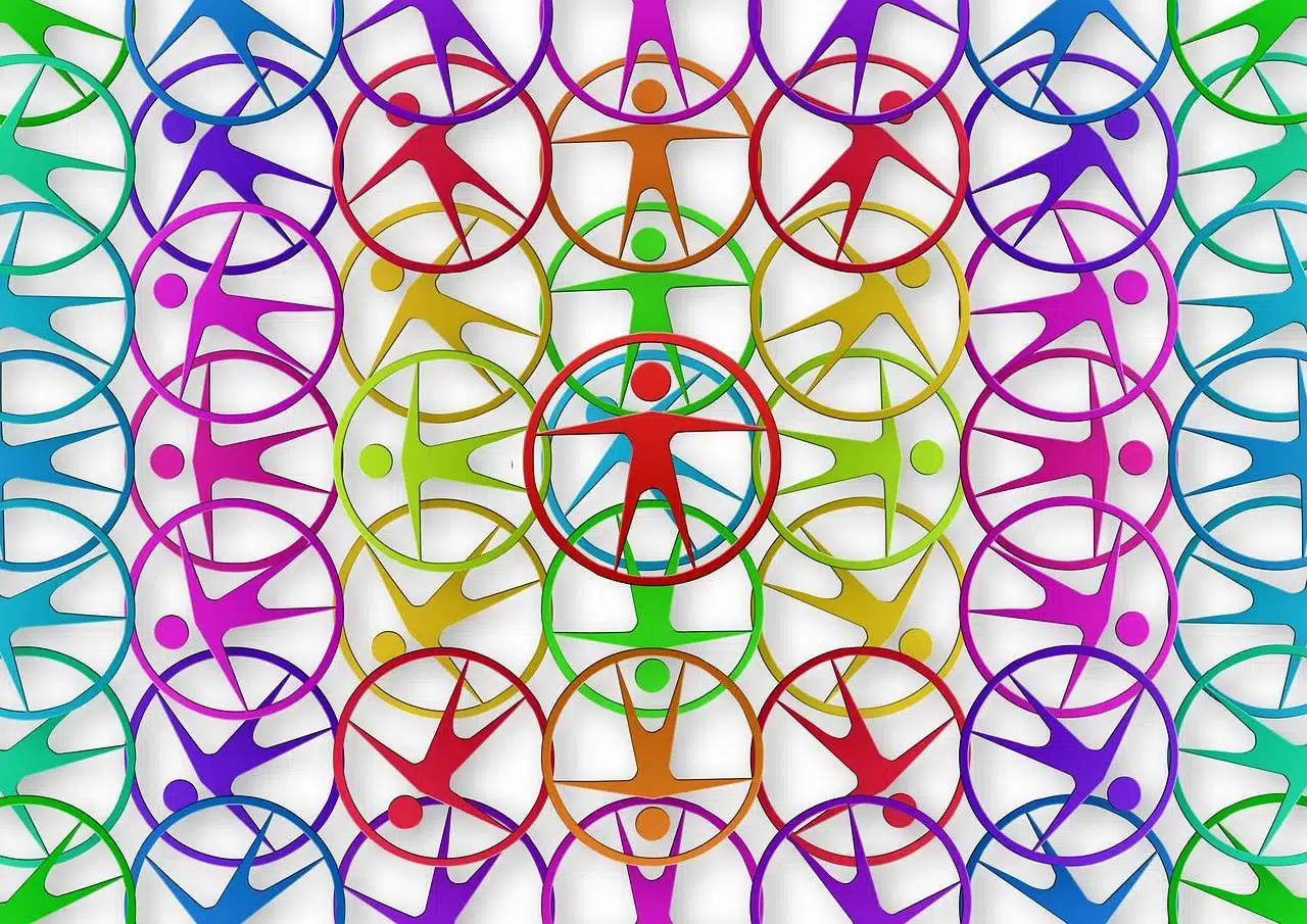 Colorful abstract design featuring human figures inside circles, overlapping in a concentric design, symbolizing unity and diversity in vibrant hues.