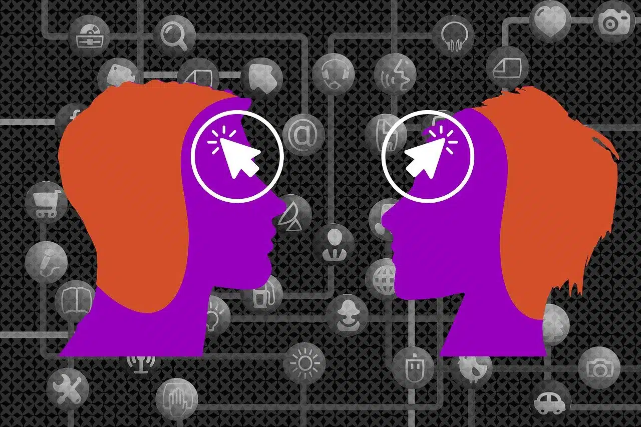 An illustration of two purple human head silhouettes facing each other on a dark, circuit board-like background filled with gray technology and communication icons. White mouse cursors with glowing circles are superimposed over their eyes, symbolizing interaction and connection, specifically related to AI and communication.