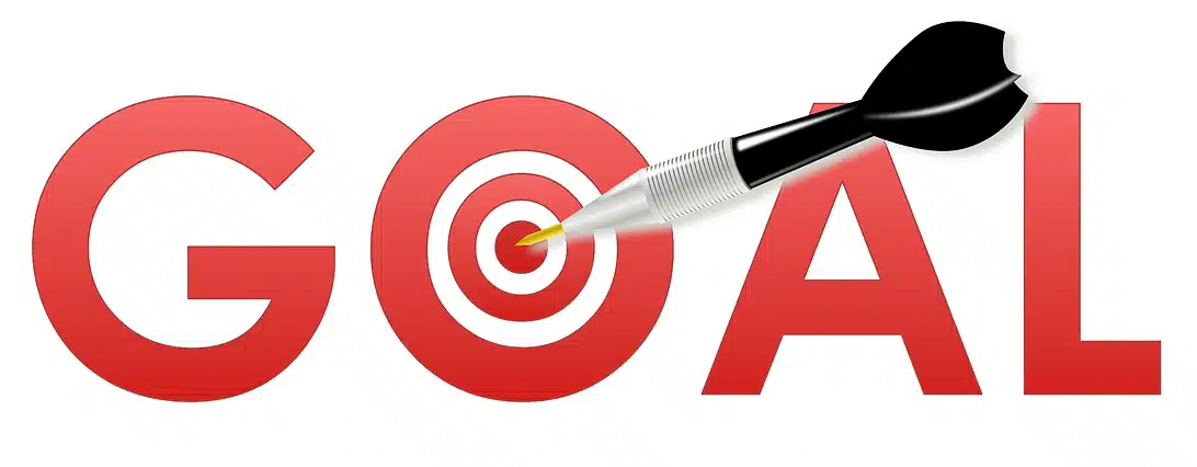 The word GOAL in red capital letters, with the letter 'O' replaced by a target and a dart accurately hitting the bullseye, symbolizing clear and achievable objectives.