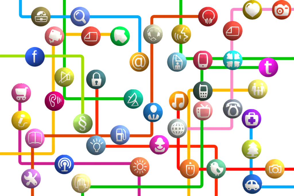 An abstract network of colorful lines connecting various spheres, each containing a different media or communication icon (e.g., camera, microphone, social media logos), symbolizing the interconnectedness of media and the wide reach of communication.