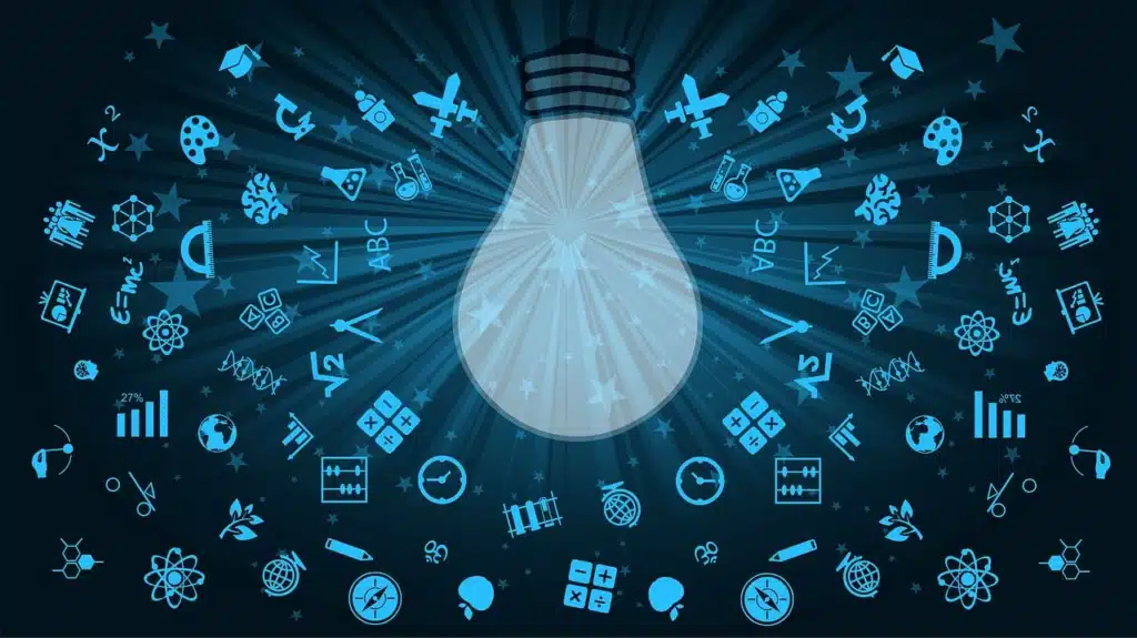 Stylized illustration of a glowing lightbulb at the center, radiating light onto a dark background filled with numerous small, glowing blue icons representing diverse subjects and learning tools, such as ABC blocks, DNA, graphs, and atoms, symbolizing innovative ideas and the illumination of knowledge across various fields.