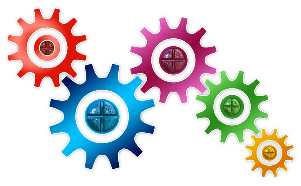 Illustration of multicolored interconnecting gears of various sizes, symbolizing the intricate and collaborative components of a well-functioning system.