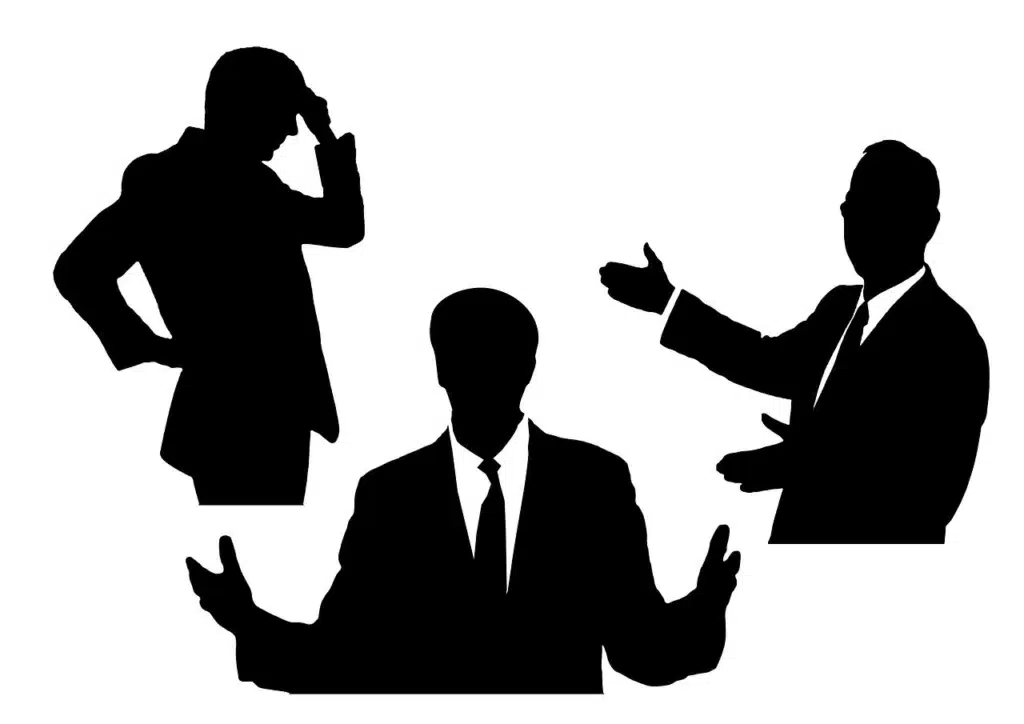 hree black silhouette figures of business professionals arranged horizontally on a transparent background. The figure on the left has their head resting in their hand, suggesting frustration or worry. The middle figure has open palms facing outward, indicating openness or honesty. The figure on the right has their arms crossed, conveying defensiveness or closed-off feelings.