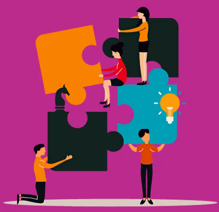 Illustration of a team working together to assemble a large puzzle, symbolizing collaboration in treating tongue tie.