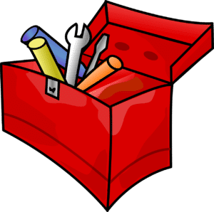 An open red toolbox filled with various tools like wrenches and screwdrivers.
