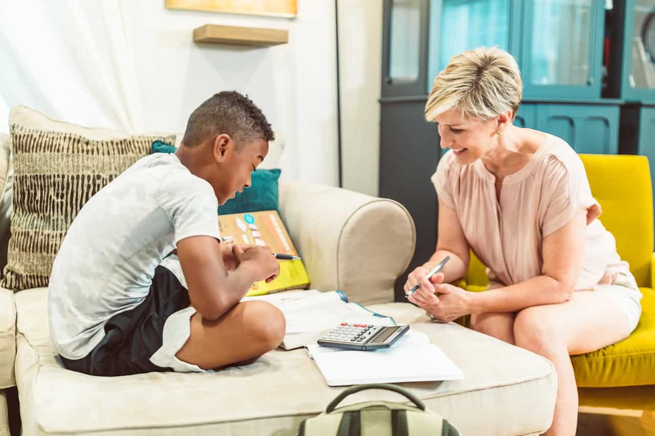 hero-gallery-03 A therapist helps a boy with academic language tasks.